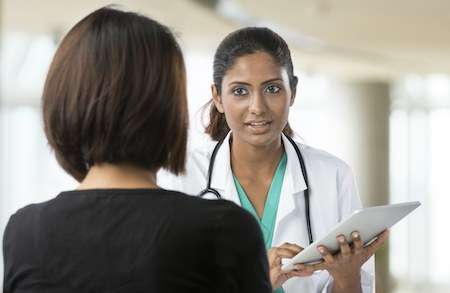 photo of doctor talking with a patient