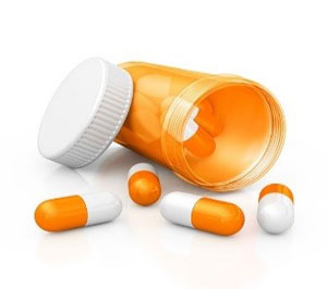 Image of pill bottle with pills spilling out