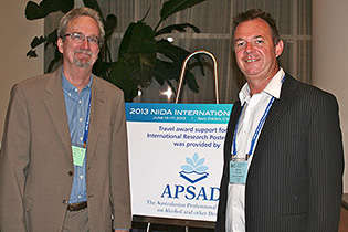 From left, NIDA International Program Director Steven W. Gust, Ph.D., and Adrian Dunlop, Australia.