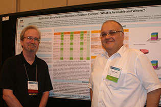 NIDA International Program Director Steven W. Gust, Ph.D., and Adrian Abagiu, Romania