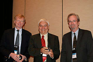 Thomas Babor, University of Connecticut and Robin Room, Australia holding their NIDA Awards of Excellence and standing next to Steve Gust, NIDA.
