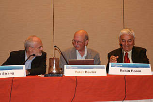 John Strang, United Kingdom; Peter Reuter, University of Maryland; Robin Room, Australia, sitting at the head table of the plenary session.