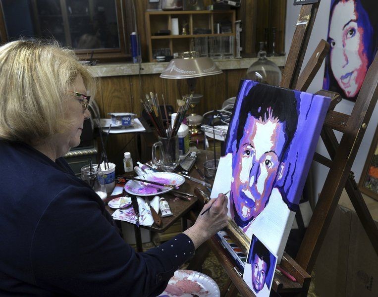 Anne Marie Zanfagna painting a portrait for Angels of Addictions. (Image by Anne Marie Zanfagna.)