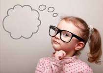 Thinking kid girl in glasses with empty bubble looking - Stock Image