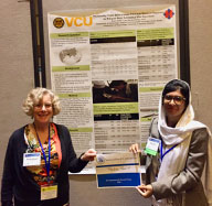 Wendy Kliewer, Virginia Commonwealth University, left, and Rabia Hanif, Pakistan, with their award-winning poster