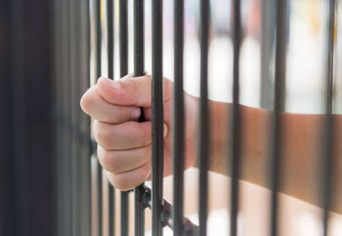 little Hand in jail