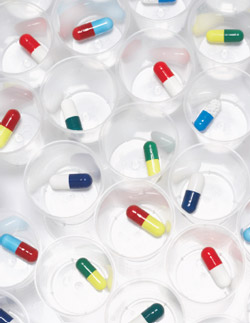 image of pills in dosing cups