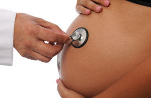 Image of a stethoscope on a pregnant woman