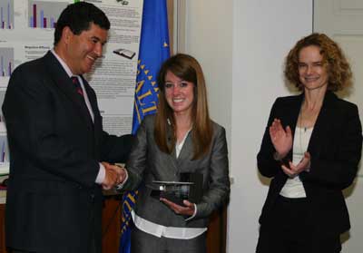 Third place award winner Shelby Raye with NIH Director Elias Zerhouni and NIDA Director Nora Volkow.